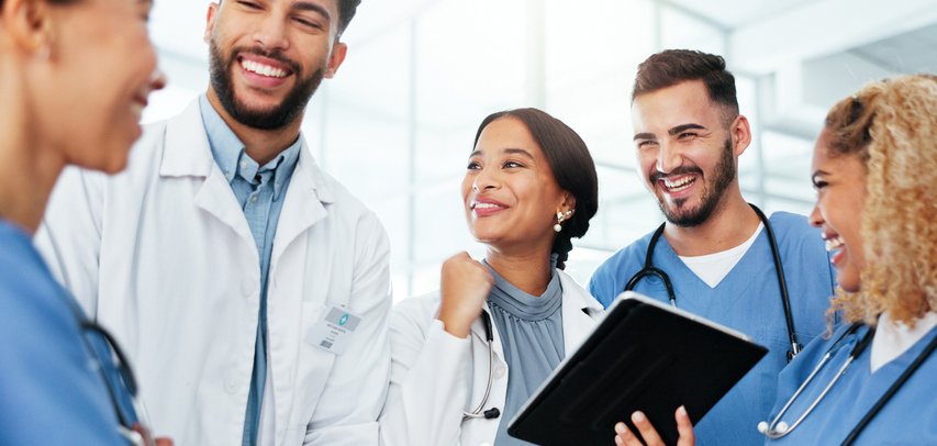 a group of excited residents on the hospital floor.
