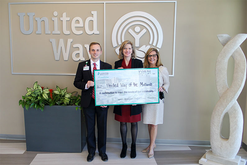 United Way of the Midlands representatives are presented an oversized check from the Lexington Medical Center Foundation, for contributions to meet the need of our community.