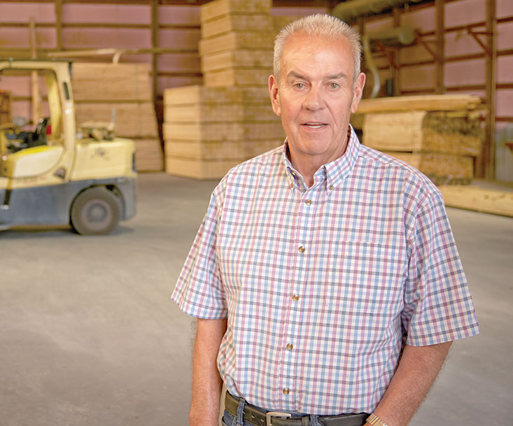 Photo of traumatic injury patient Jimmy Oswald in a warehouse.